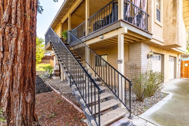616 Jackson Dr, Paso Robles, CA 93446 - view of exterior entry with a garage, stucco siding, and concrete driveway