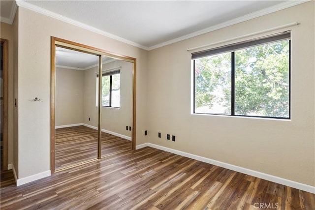 616 Jackson Dr, Paso Robles, CA 93446 - unfurnished bedroom with wood finished floors, a closet, and crown molding