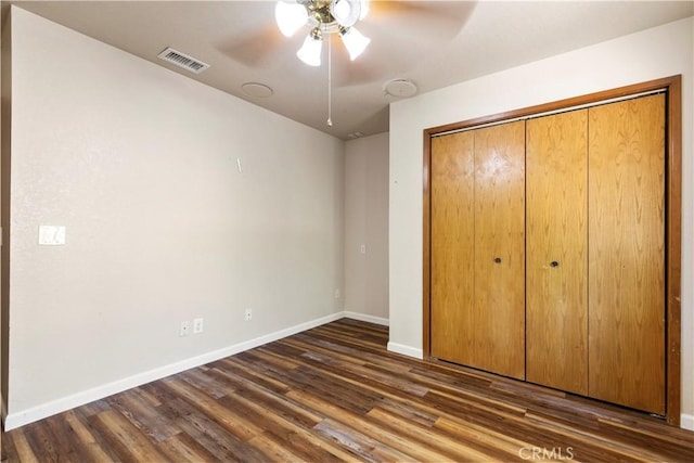 616 Jackson Dr, Paso Robles, CA 93446 - unfurnished bedroom featuring dark wood-type flooring, a closet, and a ceiling fan