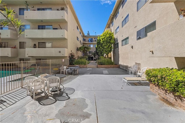 view of patio / terrace featuring fence