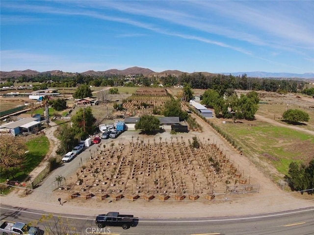drone / aerial view featuring a rural view and a mountain view