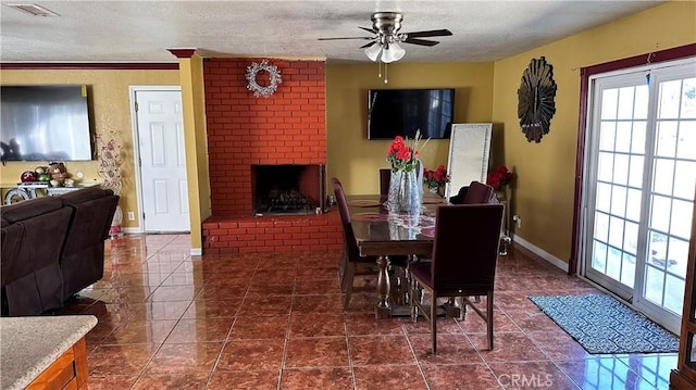 dining room with tile patterned flooring, visible vents, a textured ceiling, and a ceiling fan