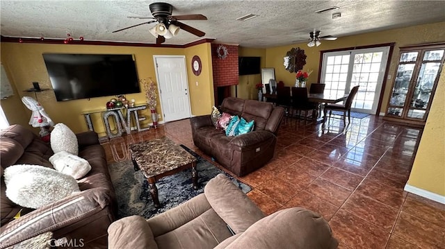 tiled living room with visible vents, ceiling fan, and a textured ceiling