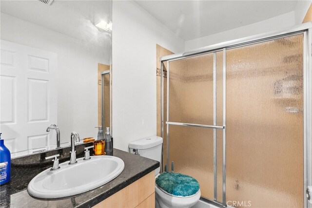 7826 Topanga Canyon Blvd Unit 101, Canoga Park, CA 91304 - bathroom featuring a shower with shower door, vanity, and toilet