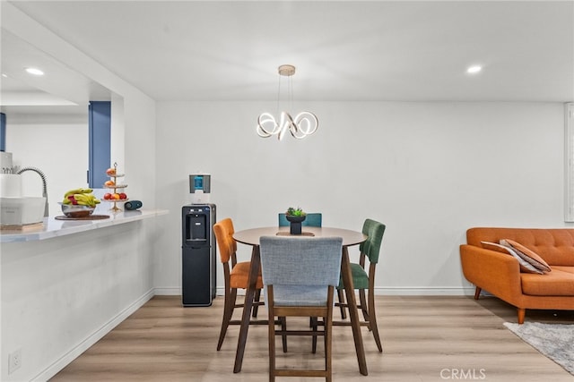 7826 Topanga Canyon Blvd Unit 101, Canoga Park, CA 91304 - dining space featuring baseboards, light wood-type flooring, and recessed lighting