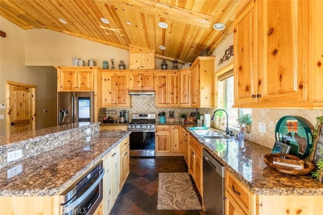 kitchen featuring vaulted ceiling, stainless steel appliances, decorative backsplash, a sink, and wood ceiling