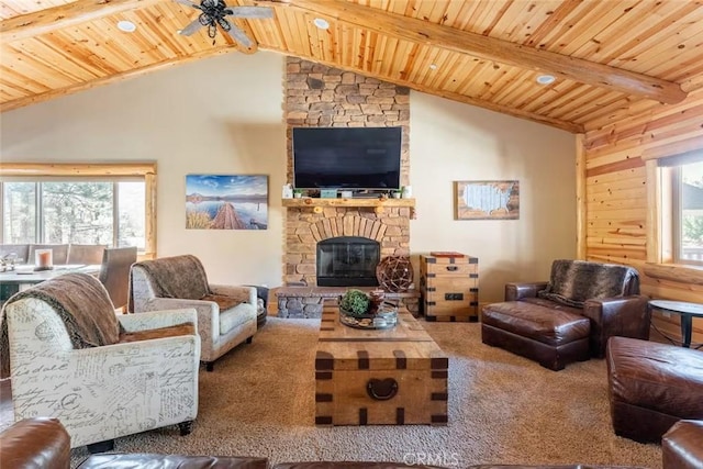 living room with a ceiling fan, wooden ceiling, carpet, and beamed ceiling