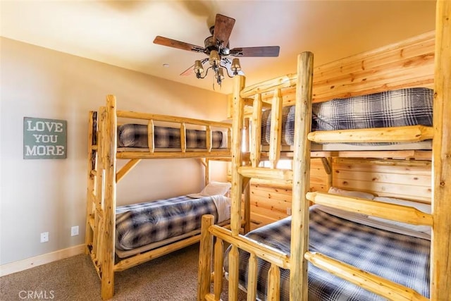 bedroom featuring baseboards and carpet floors