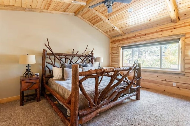 carpeted bedroom with baseboards, lofted ceiling with beams, wood walls, and wood ceiling
