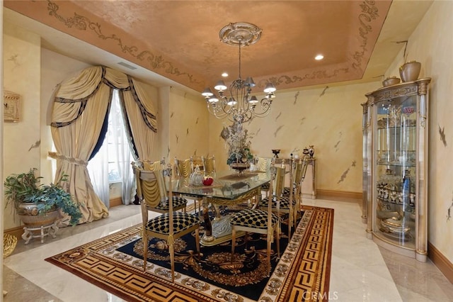 dining area with a raised ceiling and an inviting chandelier