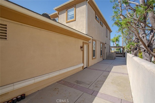 view of property exterior featuring a patio