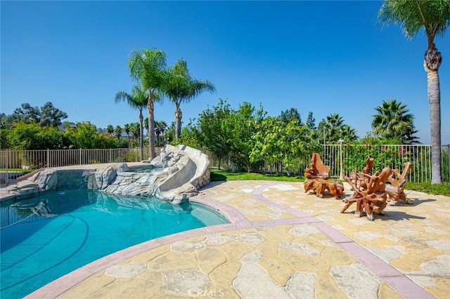 view of swimming pool featuring a patio area