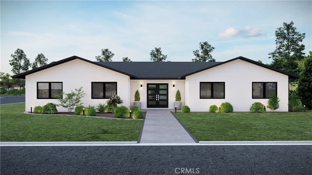 view of front of house featuring a front lawn and french doors