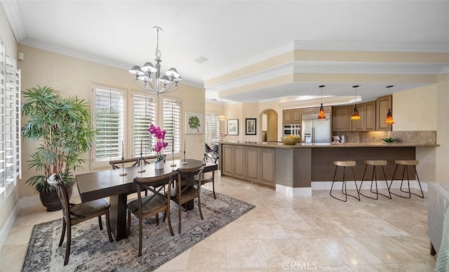 3 Mesquite Ridge Ln, Rancho Mirage, CA 92270 - dining room with a chandelier, ornamental molding, and arched walkways