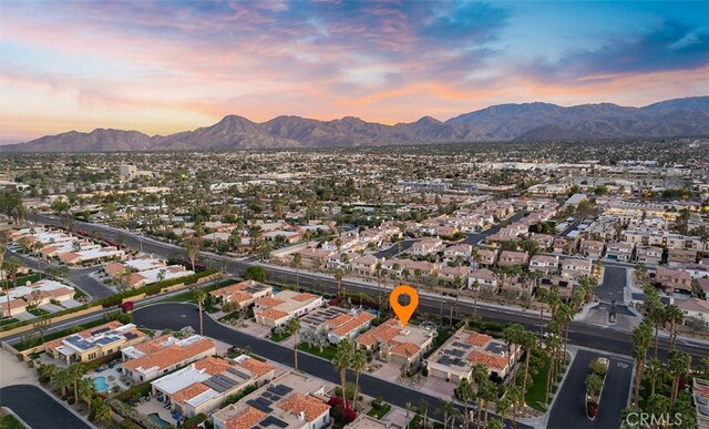 3 Mesquite Ridge Ln, Rancho Mirage, CA 92270 - aerial view at dusk with a residential view and a mountain view