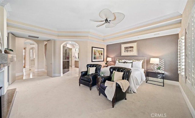 3 Mesquite Ridge Ln, Rancho Mirage, CA 92270 - bedroom featuring arched walkways, carpet floors, ornamental molding, a raised ceiling, and ensuite bath