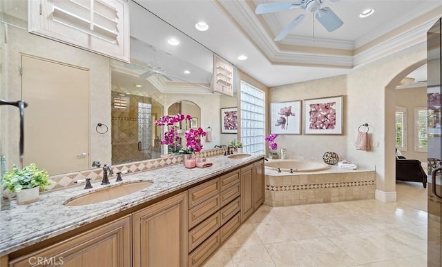 3 Mesquite Ridge Ln, Rancho Mirage, CA 92270 - bathroom featuring ceiling fan, ornamental molding, healthy amount of natural light, double vanity, and a garden tub