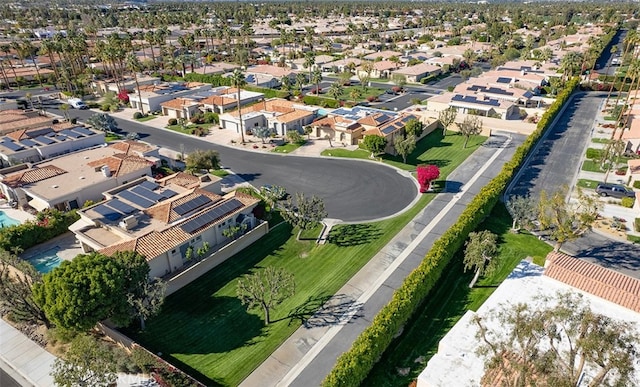 birds eye view of property with a residential view