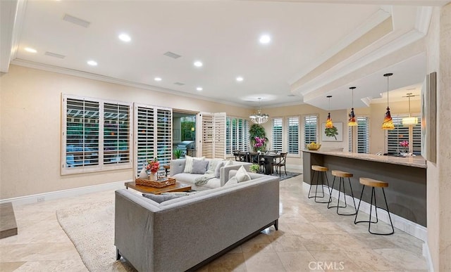 living room featuring visible vents, ornamental molding, baseboards, and recessed lighting