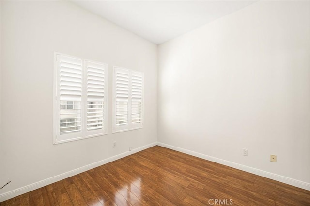 spare room with hardwood / wood-style flooring