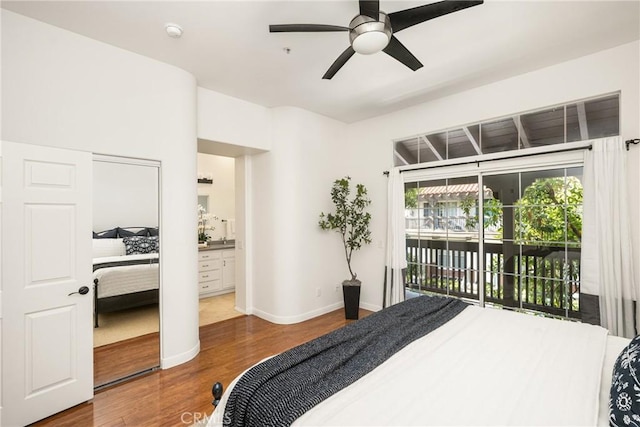 bedroom featuring ceiling fan, wood-type flooring, and access to exterior