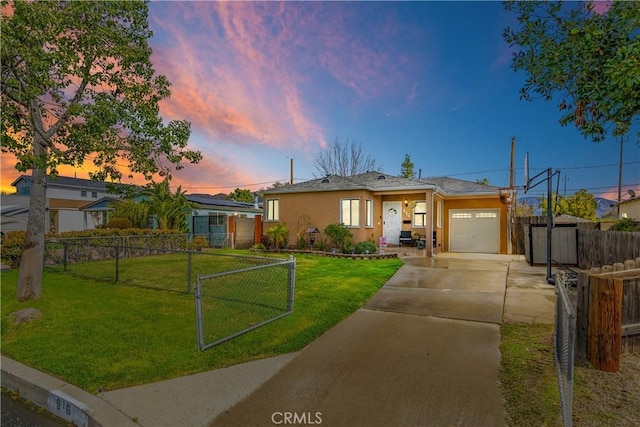 ranch-style house with a garage and a lawn