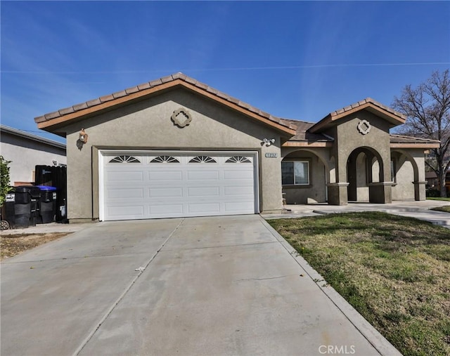 view of front of house with a front lawn and a garage