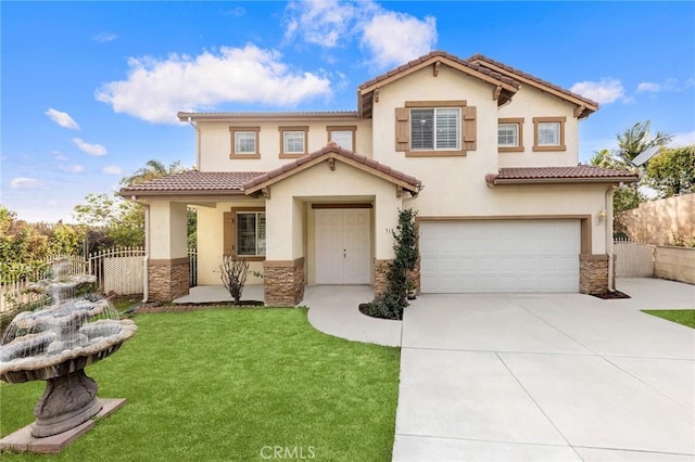 mediterranean / spanish-style house with a garage and a front yard