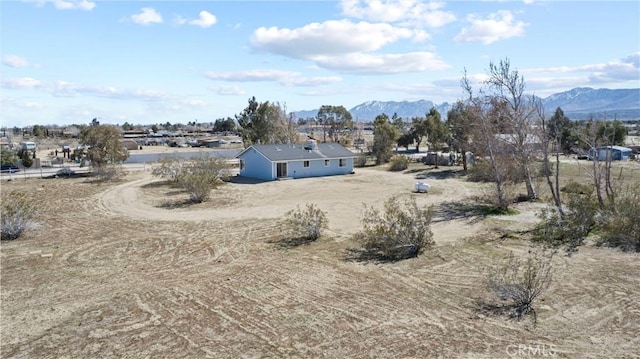 birds eye view of property featuring a mountain view