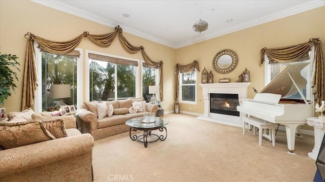 living room with baseboards, carpet floors, a glass covered fireplace, and crown molding