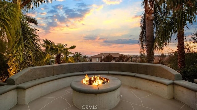 exterior space featuring an outdoor fire pit