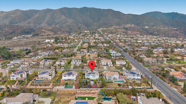 drone / aerial view with a residential view and a mountain view