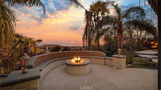 view of patio / terrace with an outdoor fire pit