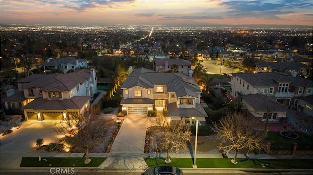 birds eye view of property with a residential view