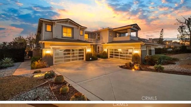 view of front of house with a garage and concrete driveway