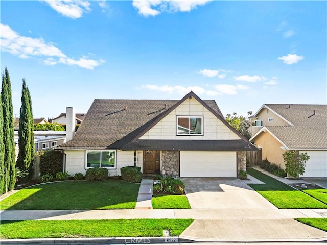 view of front of home featuring roof with shingles, a garage, stone siding, driveway, and a front lawn