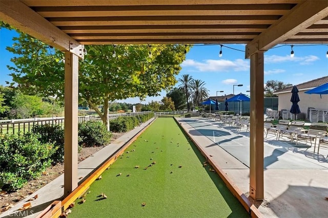 view of community featuring fence