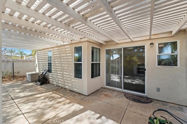 view of patio / terrace with fence and a pergola