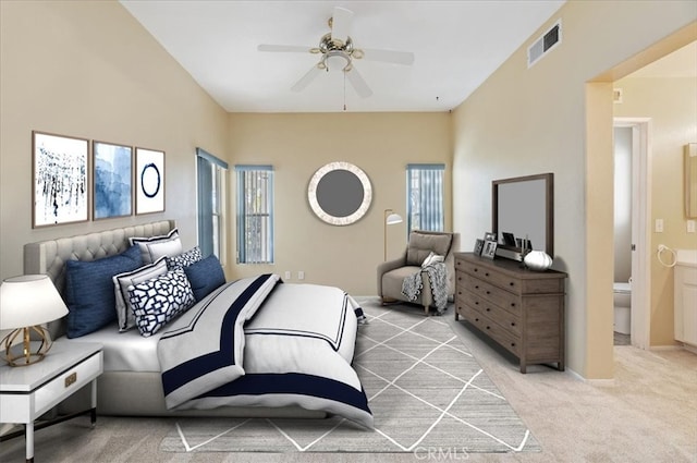 bedroom featuring light carpet, ceiling fan, visible vents, and baseboards