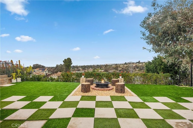 view of patio with fence and an outdoor fire pit