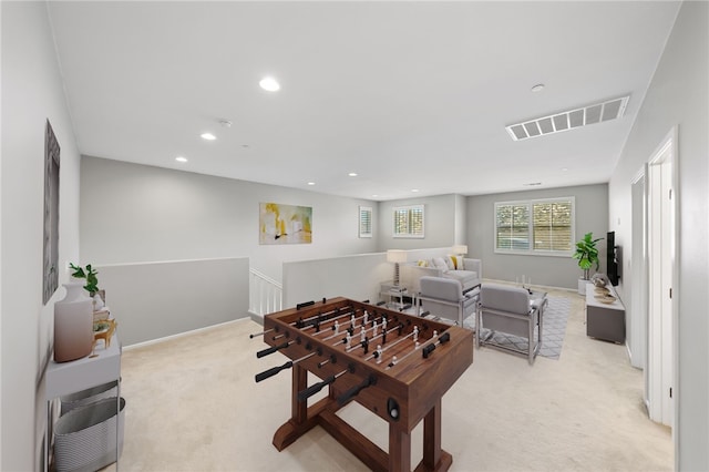 rec room with recessed lighting, visible vents, light carpet, and baseboards