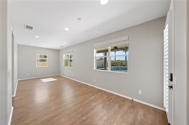 spare room with recessed lighting, baseboards, visible vents, and light wood finished floors