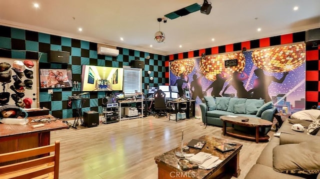 living room with a wall unit AC and light hardwood / wood-style flooring