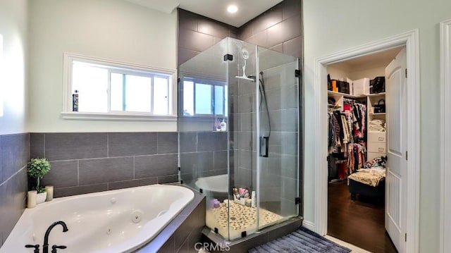 bathroom with shower with separate bathtub