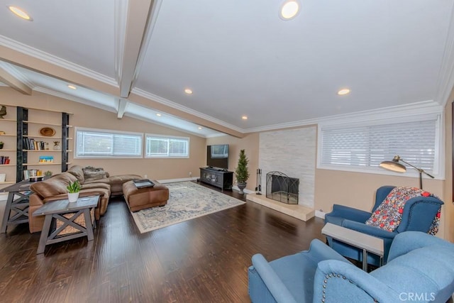 living room with lofted ceiling with beams, plenty of natural light, dark wood-type flooring, and a fireplace