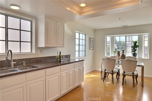 32 Diamond St Unit D, Arcadia, CA 91006 - kitchen with crown molding, white cabinetry, light wood-style floors, dark stone countertops, and recessed lighting