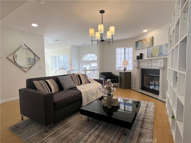 32 Diamond St Unit D, Arcadia, CA 91006 - living area featuring wood finished floors, a chandelier, a glass covered fireplace, and recessed lighting