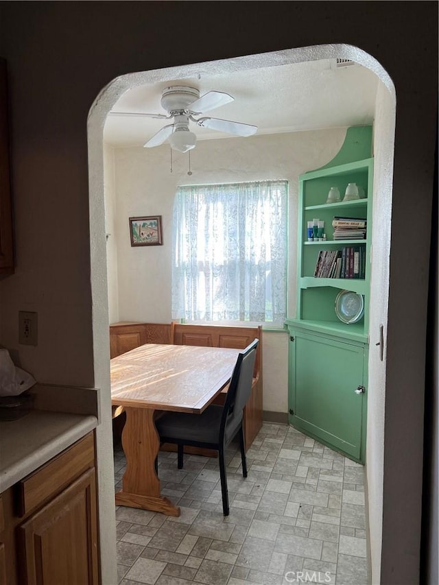 dining space with ceiling fan