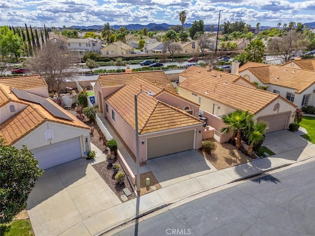 birds eye view of property with a residential view