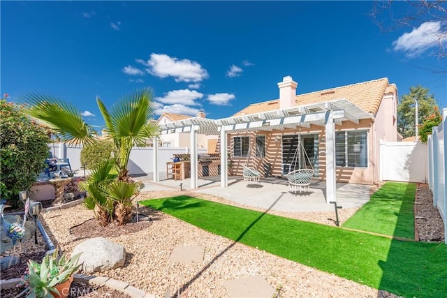 back of property with stucco siding, a patio area, a pergola, a fenced backyard, and a tiled roof